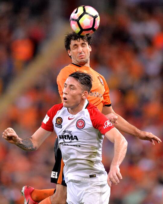 UP THERE: Scott Neville goes for a header. 
Picture: Getty Images