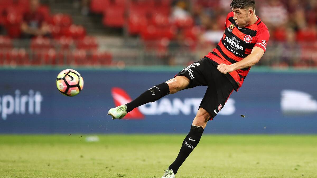 GOOD GAME: Scott Neville takes a shot at goal against the Wellington Phoenix. Picture: Getty Images
