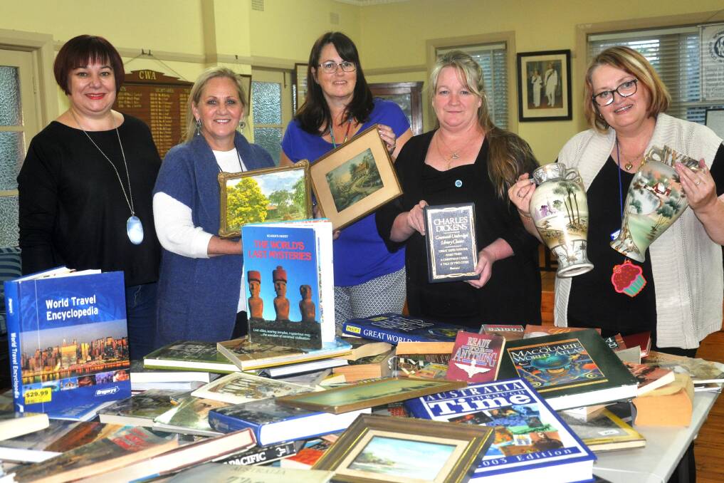 Time to pass on your unwanted treasures? Register now for the next Garage Sale Trail in October. Pictured at Richmond CWA's garage sale last year is Mayor Mary Lyons-Buckett (second from left) with CWA members.