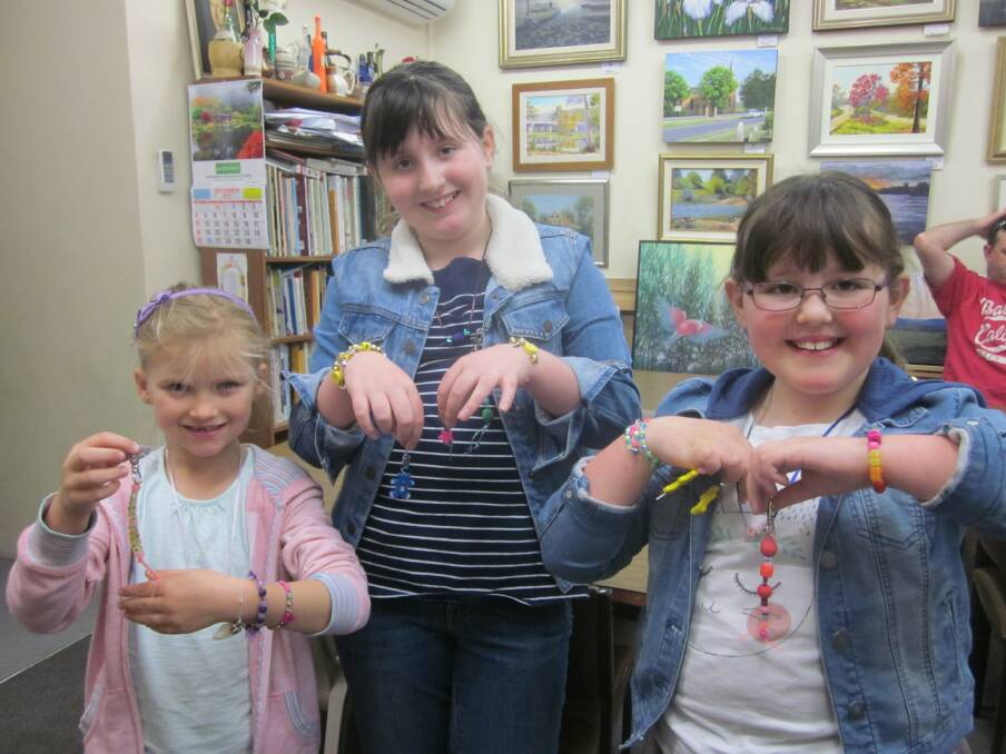 Participants in one of last year's jewellery-making class with some of their creations.