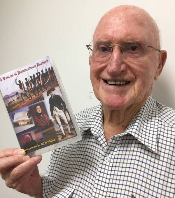 John Miller with the DVD of his acclaimed talk which is available at three different locations.
