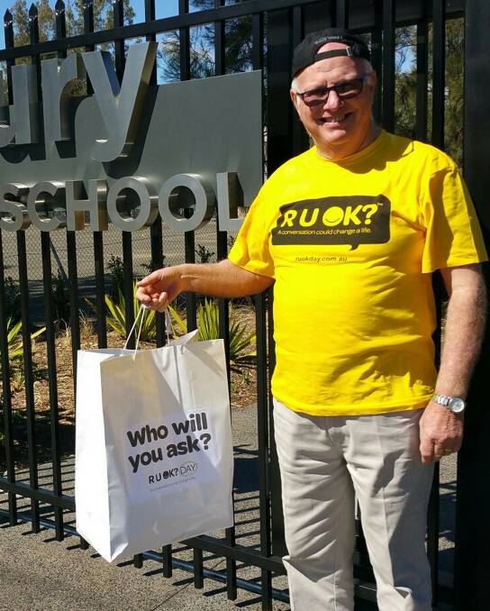 David Fleetwood of the Suicide Prevention and Support Network Western Sydney drops the RUOK merchandise off at Hawkesbury High School.