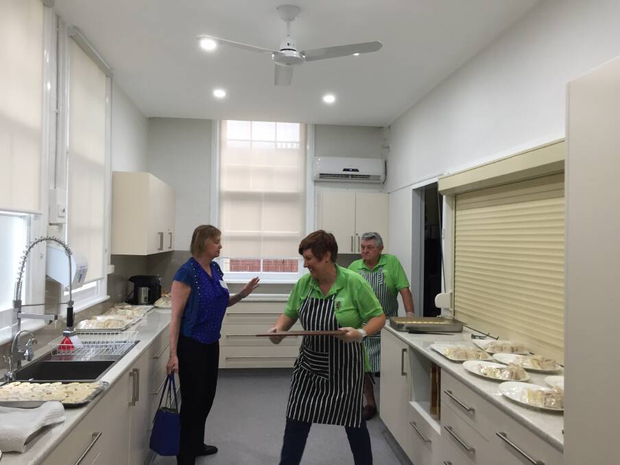 Department of Veterans Affairs' Maryanne Steinman and volunteers Tracey Kelleher and Steve Constantine in the new kitchen before the launch.