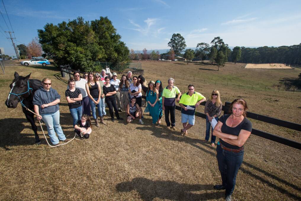 Miranda Daly and residents at the site proposed for the mobile phone tower on Comleroy Road at Kurrajong. Picture: Geoff Jones