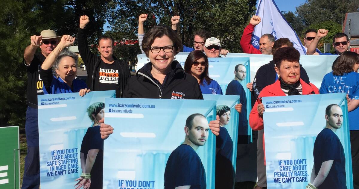 CARERS UNITE: ACTU's Ged Kearney leads the launch of the Hawkesbury campaign of nurses and aged care staff to let voters know what the impacts will be of the $1.2b cut to their sector. Annette Ryan is in orange at right.