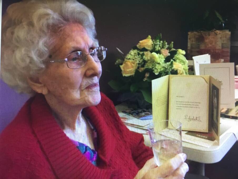 Fabulous at 100: Lorna Campbell, formerly of South Windsor, enjoys a champers at her 100th birthday bash at Beecroft.