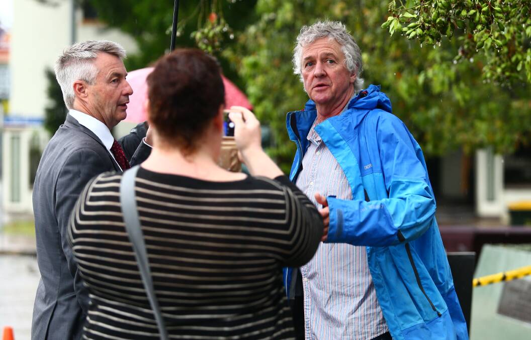 STAR POWER: Shane Withington from Home and Away and A Country Practice with a Channel 7 presenter is snapped by a passerby at Thompson Square on Friday. Picture: Geoff Jones