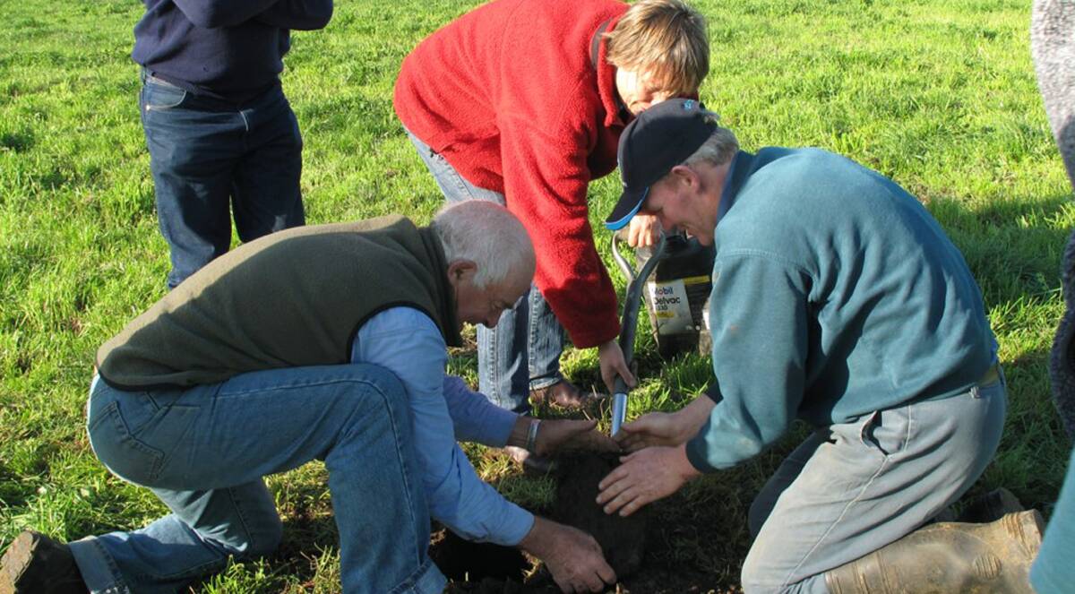 Participants check out soil texture at a previous workshop last winter. 