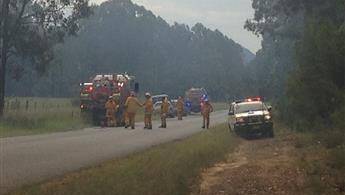 ON THE JOB: RFS crews confer during their response to the fire. Picture: Top Notch