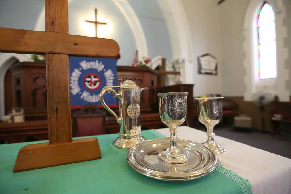 The church's communion silverware is known to be more than 100 years old, but could be rather older. It's known the wooden cross next to it is from wood from a demolished church, but which one is now lost to time. Picture: Geoff Jones