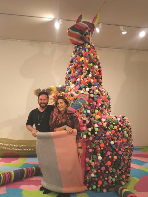 Artists Liam Benson and Rosie Deacon with Rosie's work 'Kanga Souvenir Picnic'.