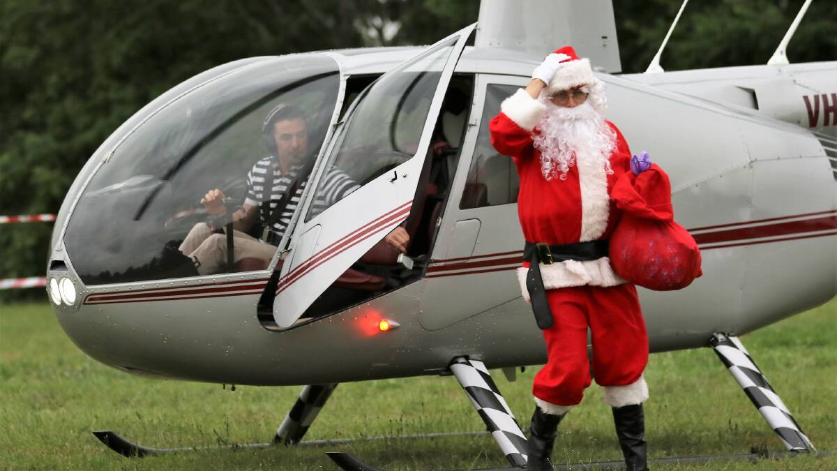 Santa's chopper arrives safely at North Richmond. 