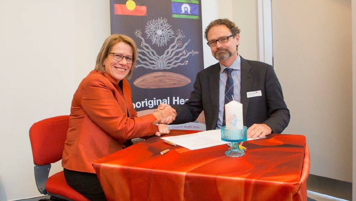 St John of God Hospital at North Richmond acting director of mission Cathy Scott and Dr Stephen Weller, COO, Australian Catholic University sign the partnership agreement to enable the ATSI Nursing Scholarship to be set up.