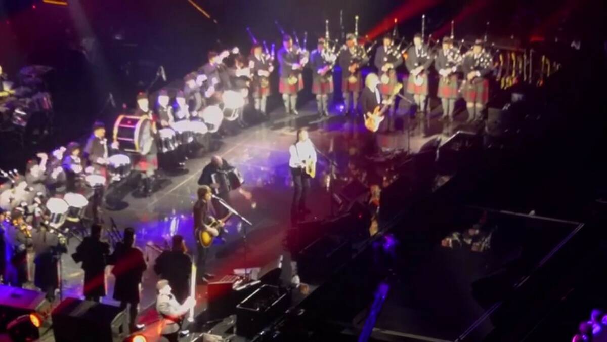 On stage with Paul McCartney: Clare Adamson is on the big bass drum at the left.