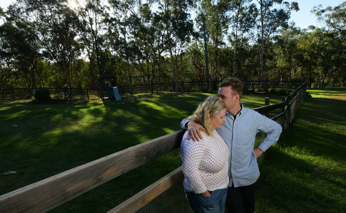 Jane Robinson is comforted by her son Anthony. Picture: Jonathan Carroll