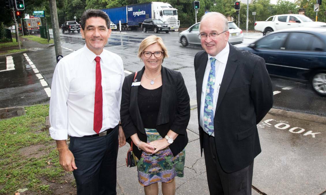 One step closer: Geoff Lee and principals Susan Middlebrook and Russell Bailey say the proposed bridge will save lives. Construction is due to start in the coming months with day and night works planned. Picture: Geoff Jones
