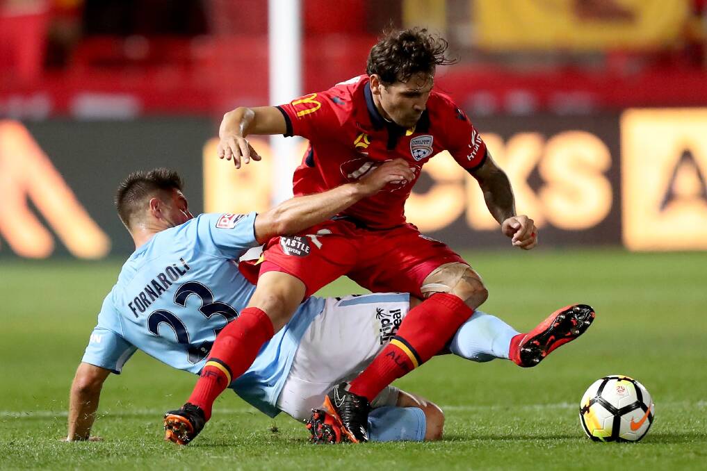 Action from the Adelaide United v Melbourne City A-League round 23 clash at Coopers Stadium. Pictures: James Elsby/AAP 