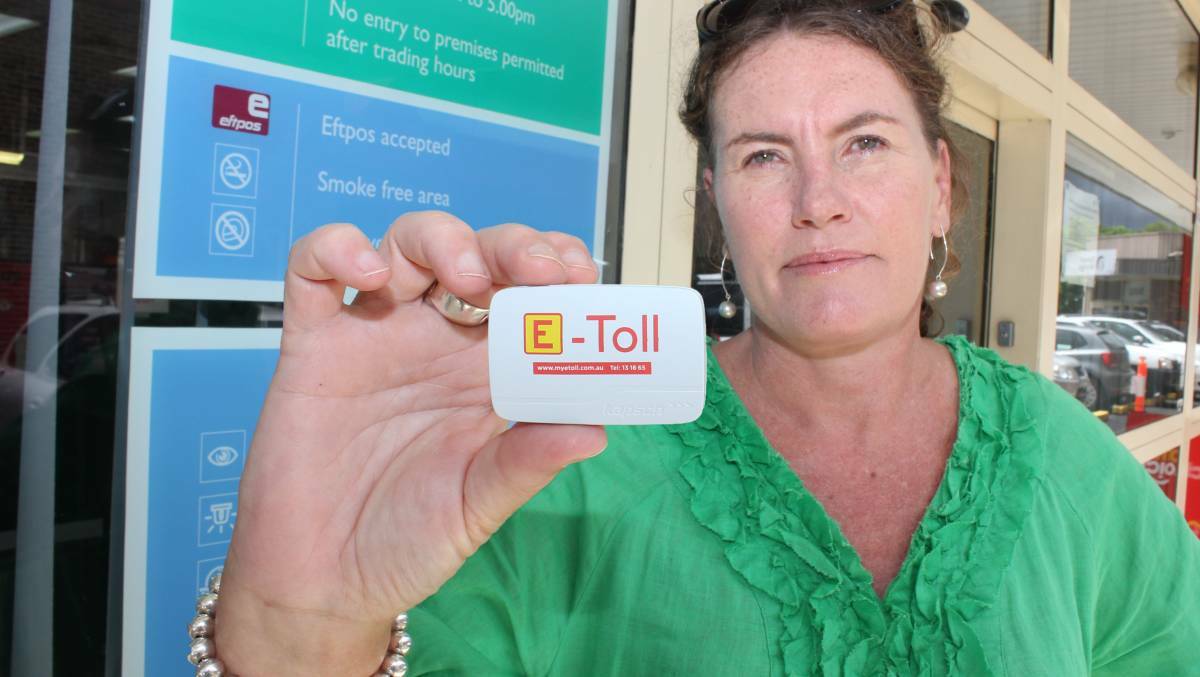 Not happy: Blue Mountains MP Trish Doyle at the Springwood Motor Registry with her first e-Tag, which she begrudgingly signed up for this week in anticipation of the new M4 tolls.