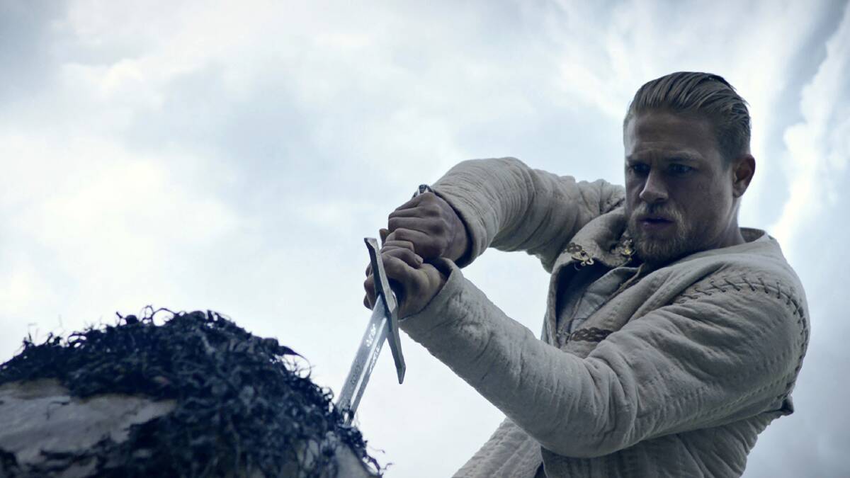The sword in the stone: Charlie Hunnam as the reimagined King Arthur Pendragon in King Arthur: Legend of the Sword, rated M, in cinemas now.