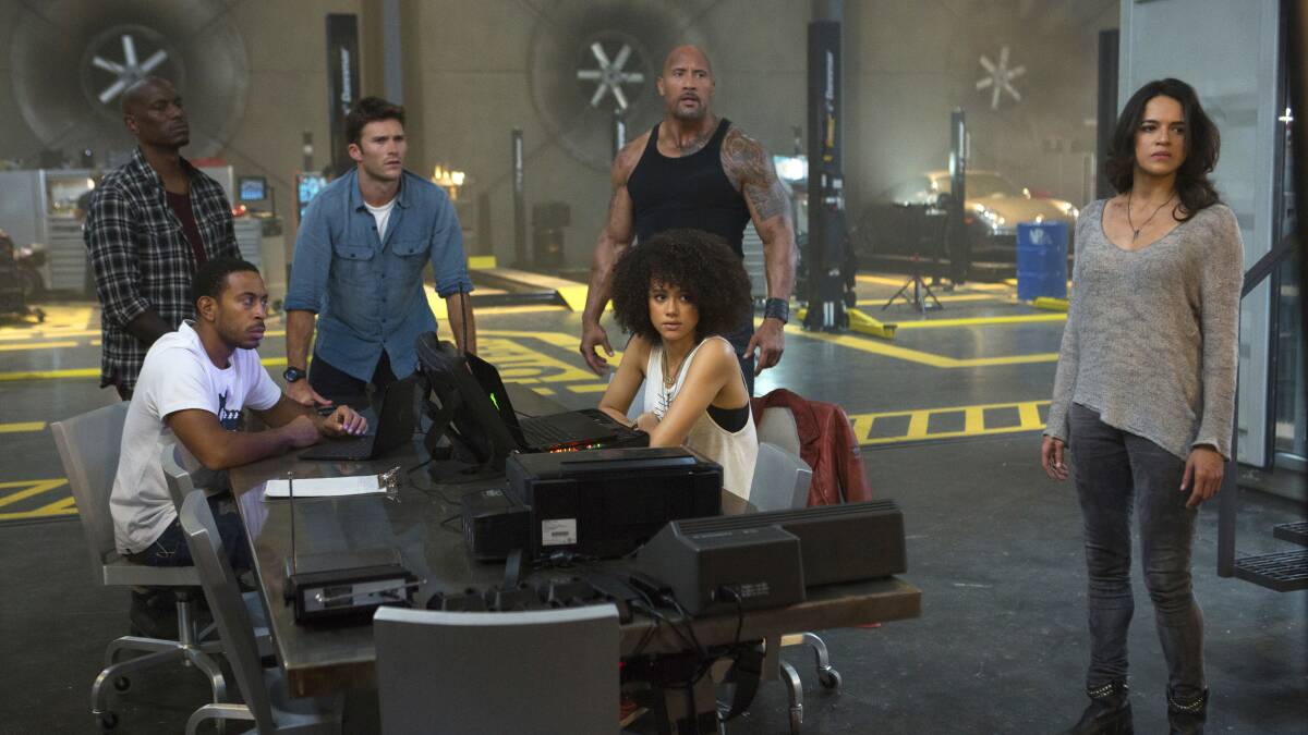 Furiously fast: Tyrese Gibson, Chris 'Ludacris' Bridges, Scott Eastwood, Dwayne 'The Rock' Johnson, Nathalie Emmanuel and Michelle Rodriguez in The Fate of the Furious, rated M, in cinemas now.