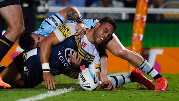 Winging it: Antonio Winterstein scores a try for the North Queensland Cowboys against the Cronulla Sharks at 1300SMILES Stadium. Photo: Getty Images