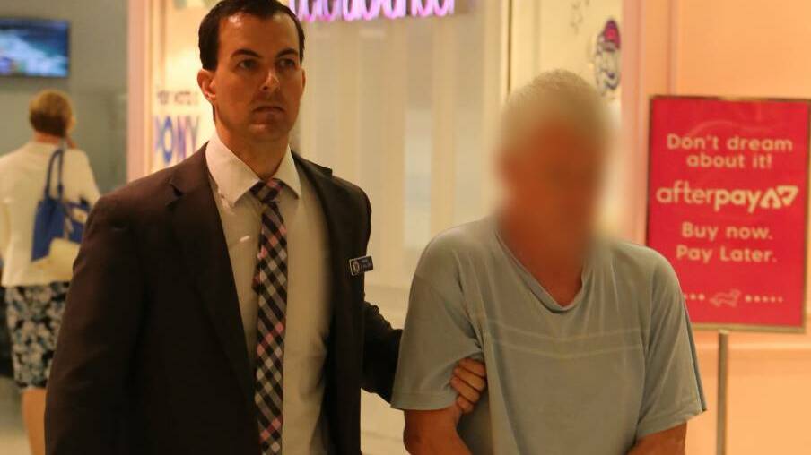  The man is escorted through Sydney airport by detectives. Picture: NSW Police.