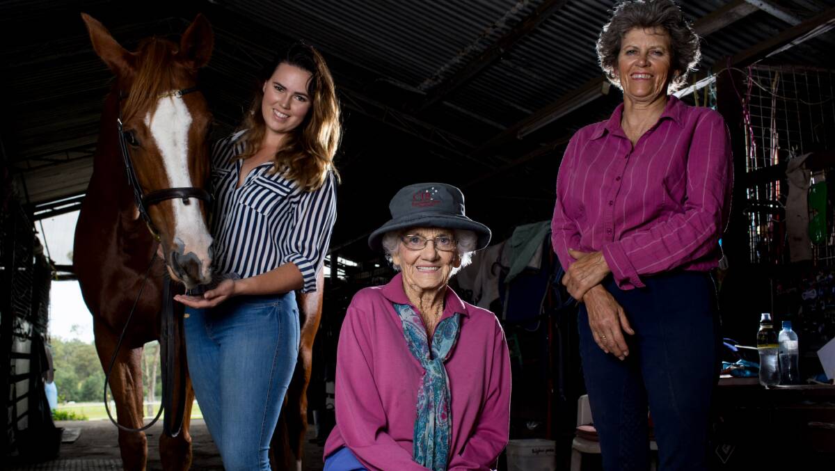 THREE GENERATIONS: Joyce Brook (centre) with daughter Colleen and grandaughter Liz and horse Tiki at their North Wilberforce property. Picture: Geoff Jones