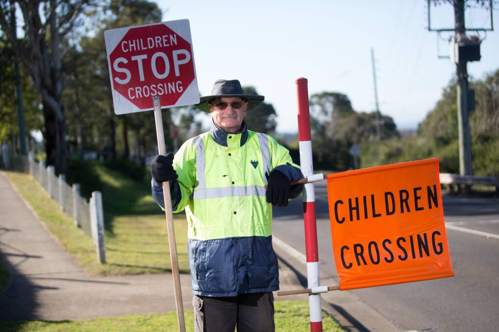 KIDS CROSSING: Chris Underwood picks-up rubbish twice a week after he finishes his morning shift as a crossing supervisor for Kurmond Public School. Picture: Geoff Jones