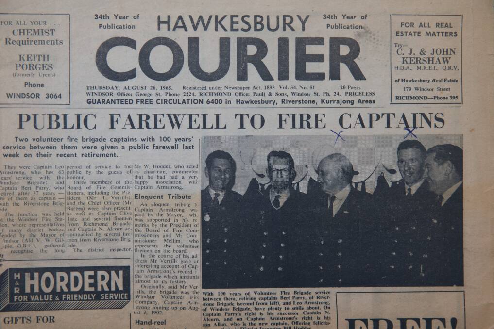 An old Hawkesbury Courier newspaper clipping from Kerry's box of firefighting keepsakes. Her great-grandfather Leo is pictured in the middle, and second-from-the-right is her grandfather Allan. Picture: Geoff Jones