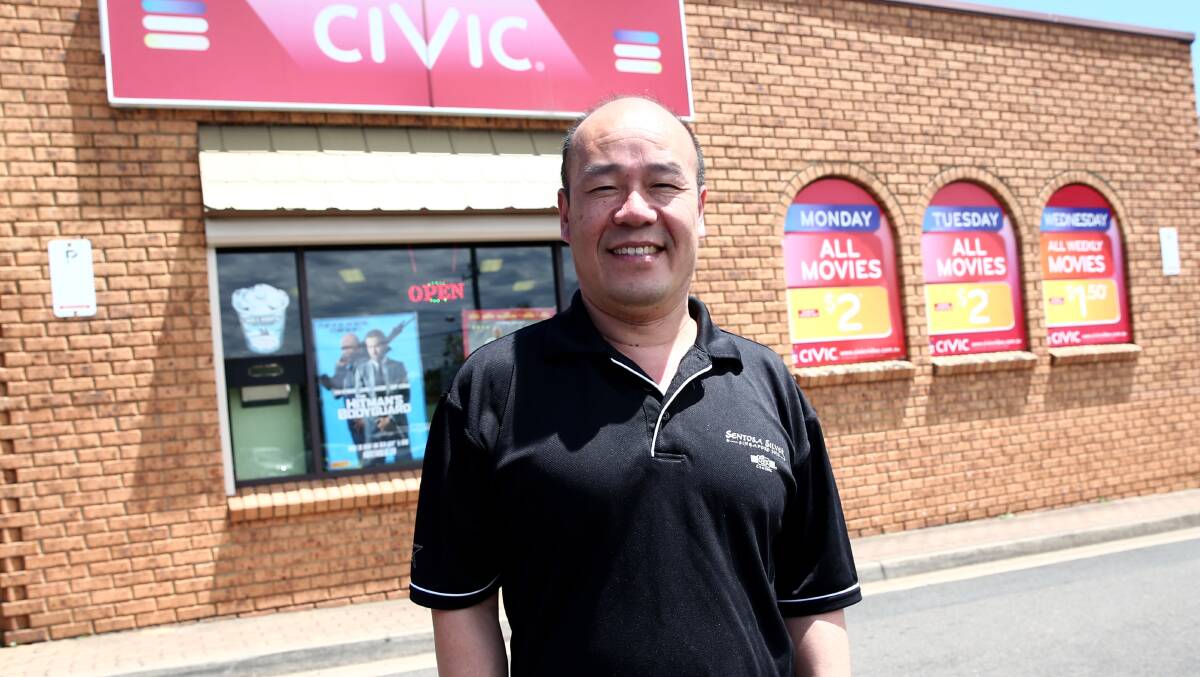 Guirong Wu at his Windsor Civic Video business which has been trading for 30 years (and counting). Pictures: Geoff Jones