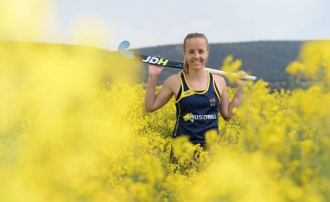 Emily Smith, the new Hockeyroos captain, down on her fiancee Dom's father's property near Cowra. Portrait by Rachael Webb.