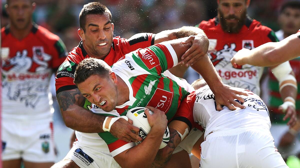 The big game: Rabbitoh Sam Burgess tackled by Dragon Paul Vaughan during Sunday's NRL Charity Shield. Picture: Getty Images