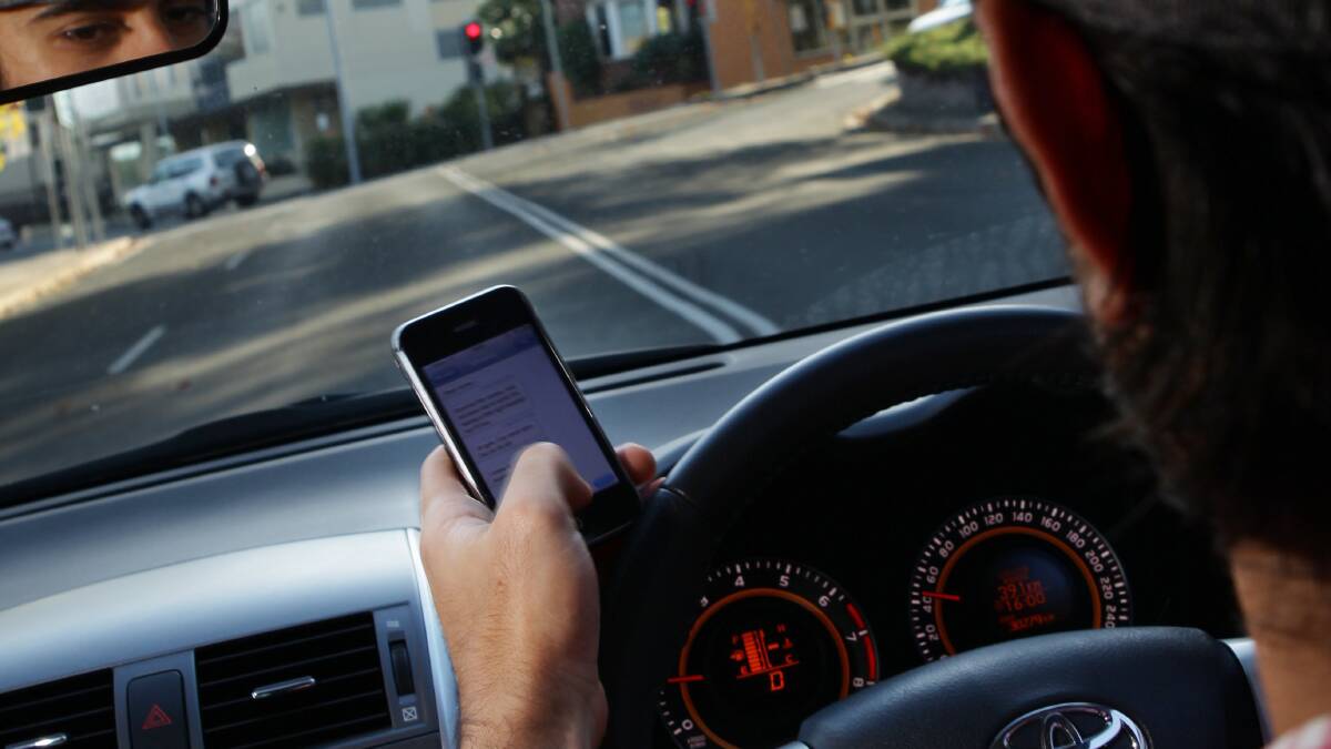 Outlawed: Provisional drivers are now banned from all mobile usage, including hands-free, whilst driving or riding, or in a stationary but not parked car. 