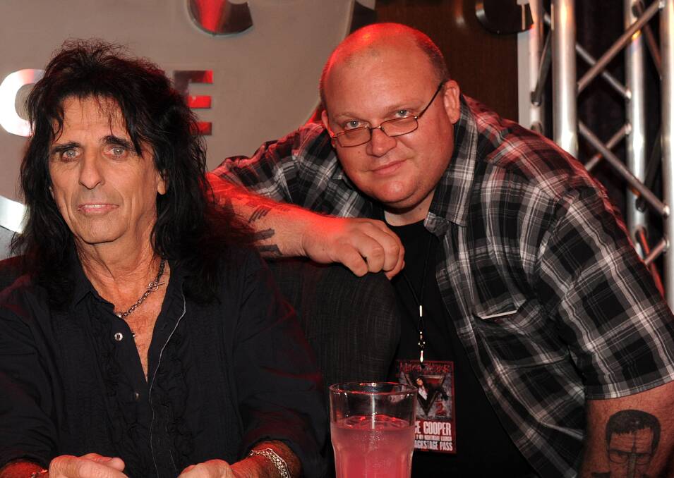 Vinyl memories: Alice Cooper's School's Out was one of Gazette editor Matt Lawrence's first LPs. He's been a fan ever since. Here he is meeting his idol in 2011. 