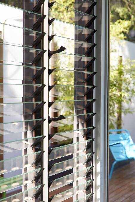 Consider your windows: Almost 90 per cent of heat gained can come through the windows in your home. Photo: Breezway Louvres by Stegbar