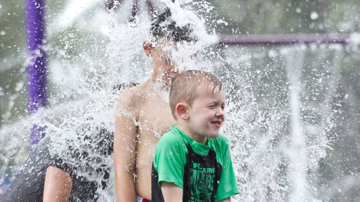 Children cool off at the Nurragingy Water Park. Picture: Geoff Jones