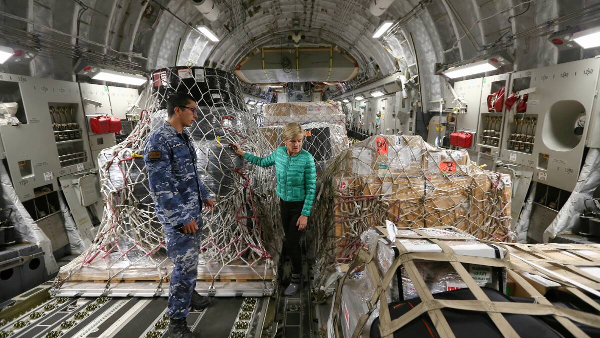 Minister for Foreign Affairs Julie Bishop inspects supplies loaded on a RAAF C-17 Globemaster bound for Fiji after it was hit by Tropical Cyclone Winston, at RAAF Base Richmond in 2016. Photo: Alex Ellinghausen