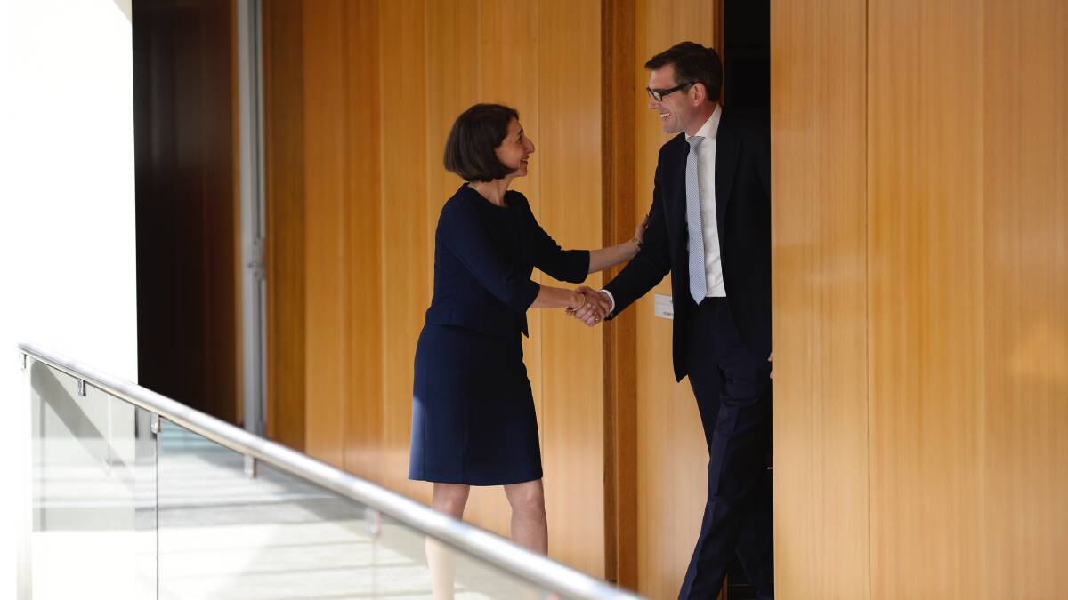 Gladys Berejiklian shakes hands with Dominic Perrottet as she leaves a Liberal Party meeting after being endorsed to be the new NSW Premier. 23rd January 2017, Photo: Wolter Peeters, The Sydney Morning Herald