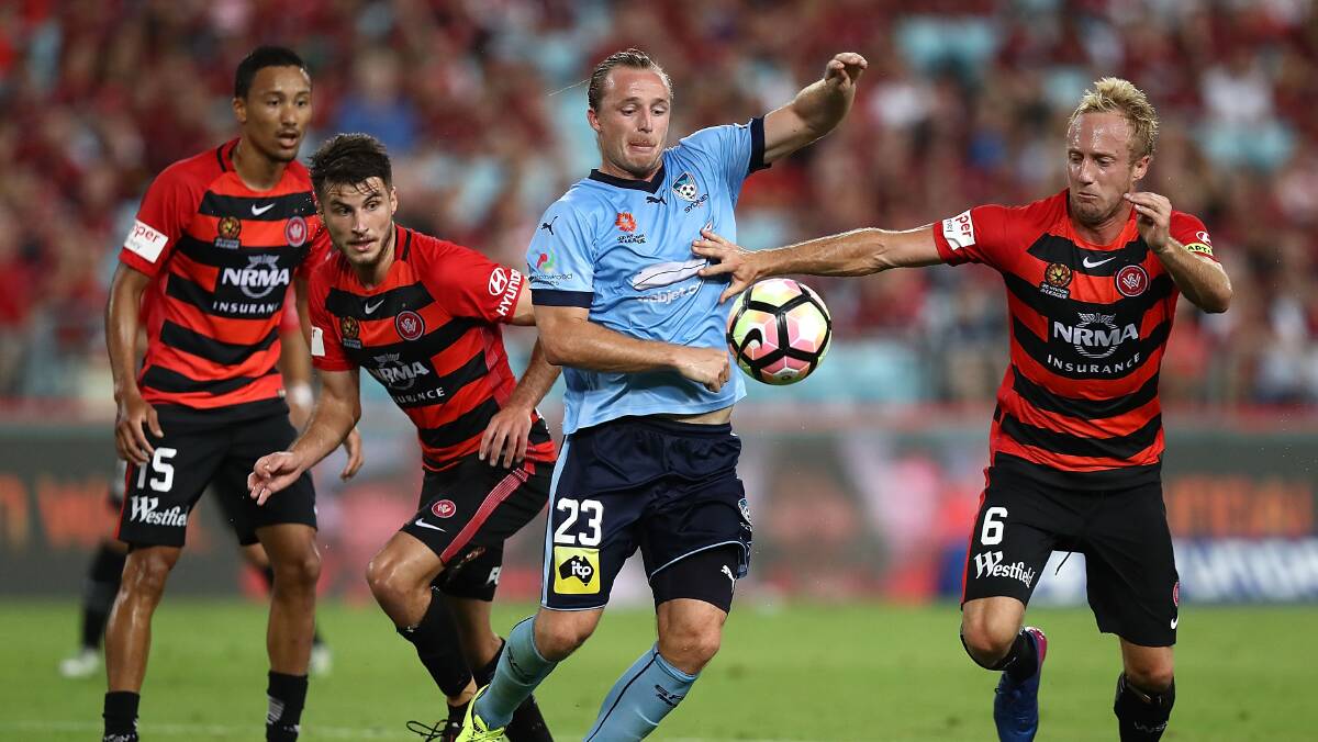 HEAT CONTEST: Sydney FC's Rhyan Grant of Sydney FC competes for the ball against Western Sydney's Mitch Nichols during the fiery Sydney Derby. Picture: Getty Images