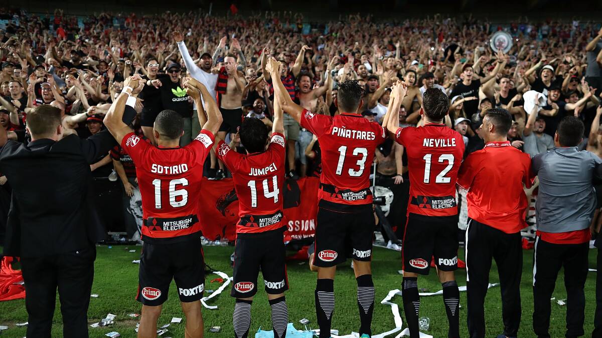 VICTORY: Western Sydney Wanderers players celebrate with their fans after their massive win over Sydney FC. Picture: Getty IMages
