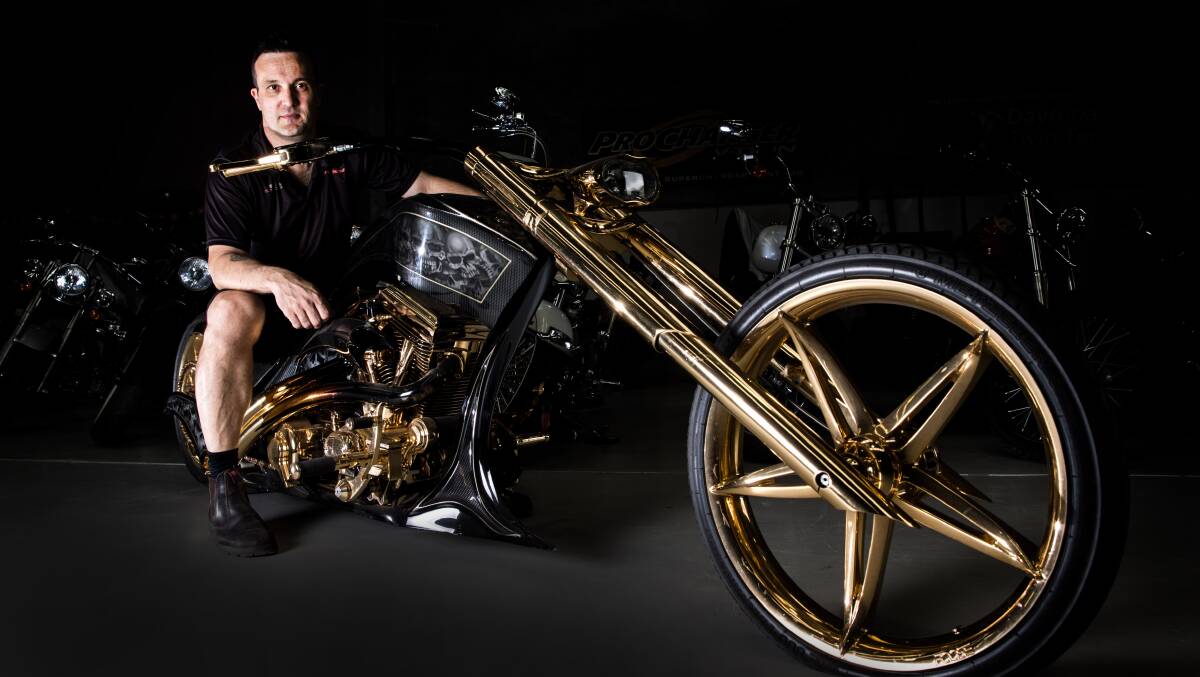 Adam Layton sits on one of his more eye-catching motorbikes. Picture: Geoff Jones