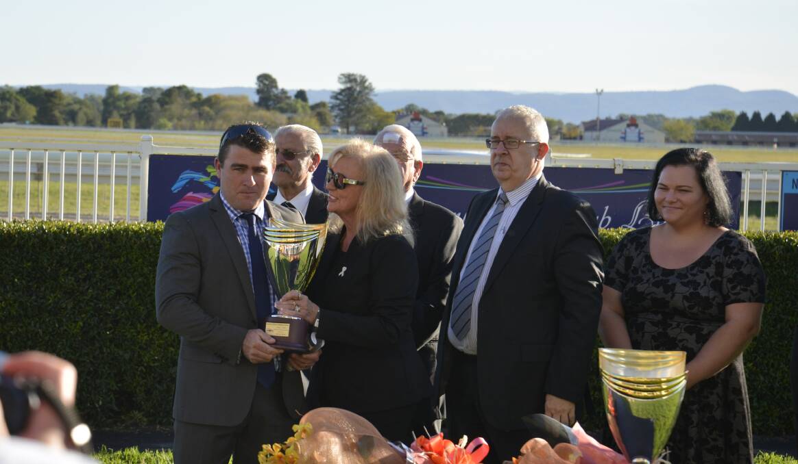 BIG RACE: Scott Singleton accepts the Hawkesbury Guineas trophy, one of Hawkesbury Race Club's black type races. Picture: Conor Hickey