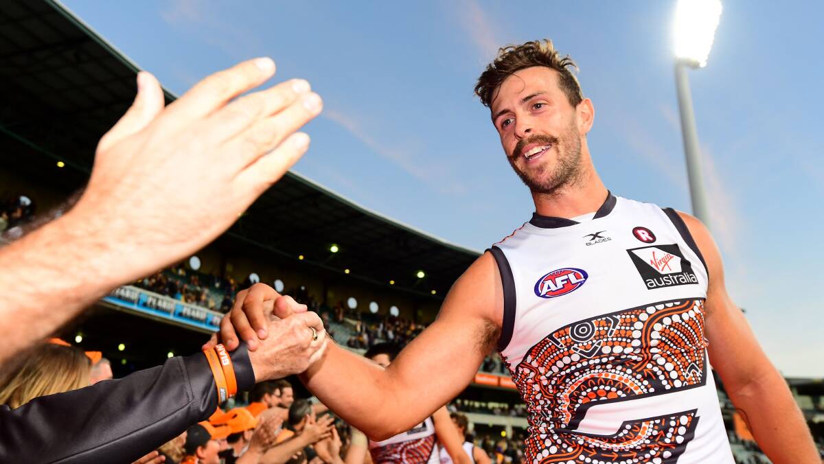 RE-SIGNED: Aidan Corr celebrates with fans after the GWS Giants round 10 match against the West Coast Eagles. Corr has re-signed until 2020. Picture: Getty Images