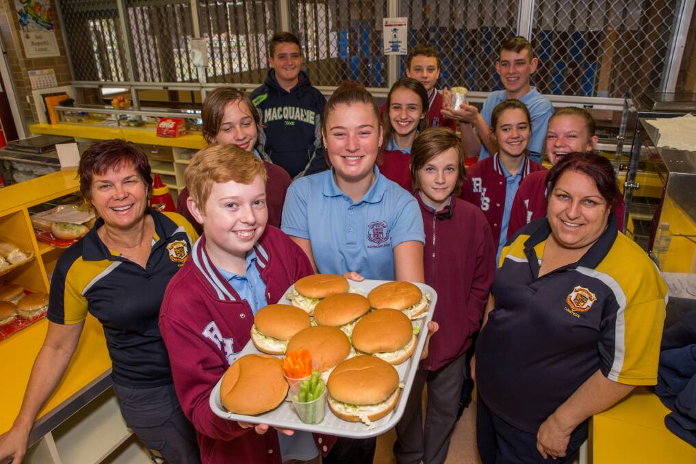 BON APPETIT: Richmond High canteen staff Cathy James (left) and Annette Cassar with students Andrew Zeschke and Erin Lackey (holding tray) along with others in the school's canteen. Picture: Geoff Jones