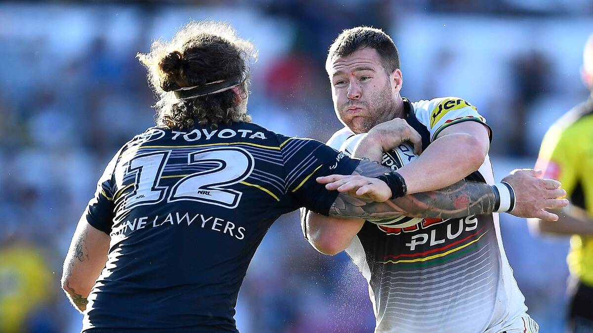 Ethan Lowe tackles Trent Merrin at a packed 1300 Smiles Stadium on June 24. Picture: Getty Images