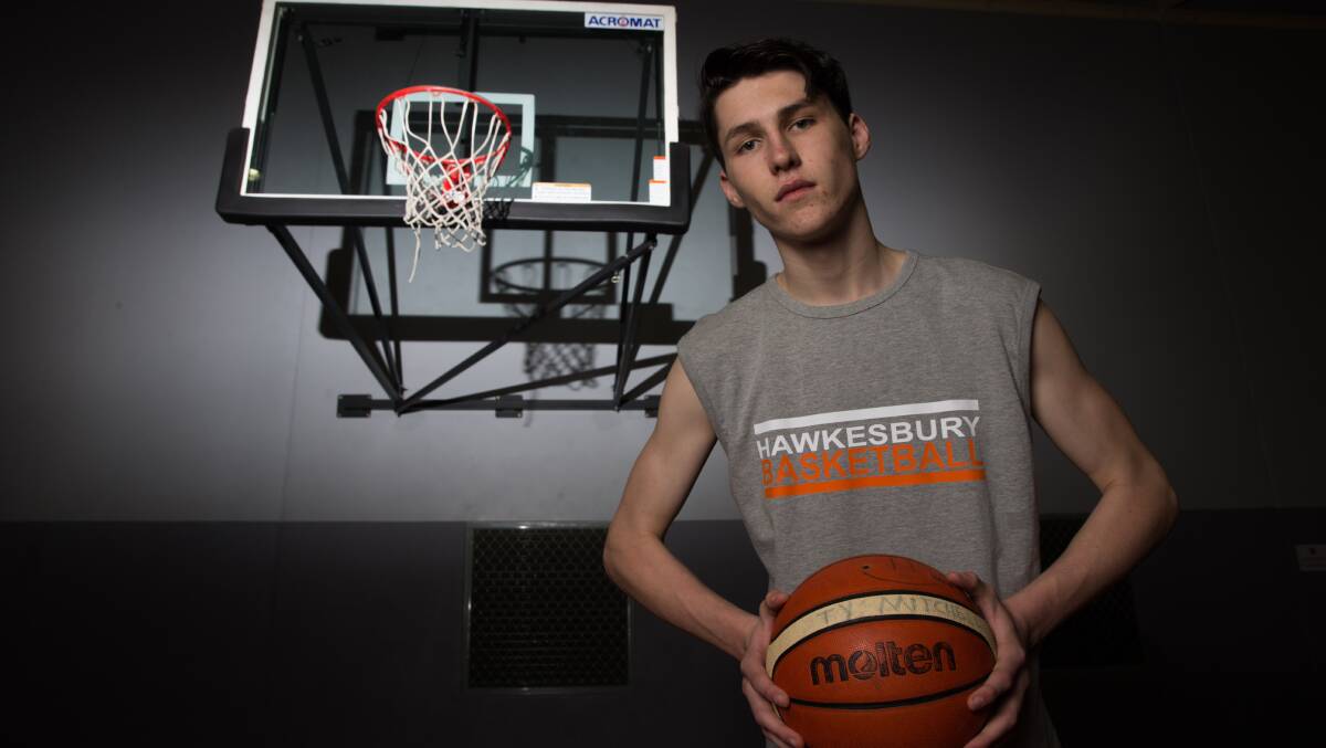 Ty Mitchell has gone from shooting the occasional hoop in his backyard to earning a scholarship to an American basketball academy. Picture: Geoff Jones 