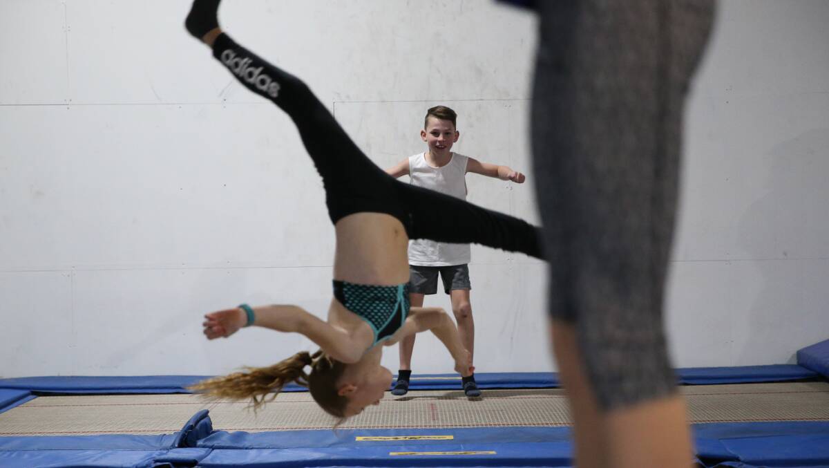 SHOWING OFF: Students at Vision Gymsports display their athletic talent on the trampolines. Picture: Geoff Jones