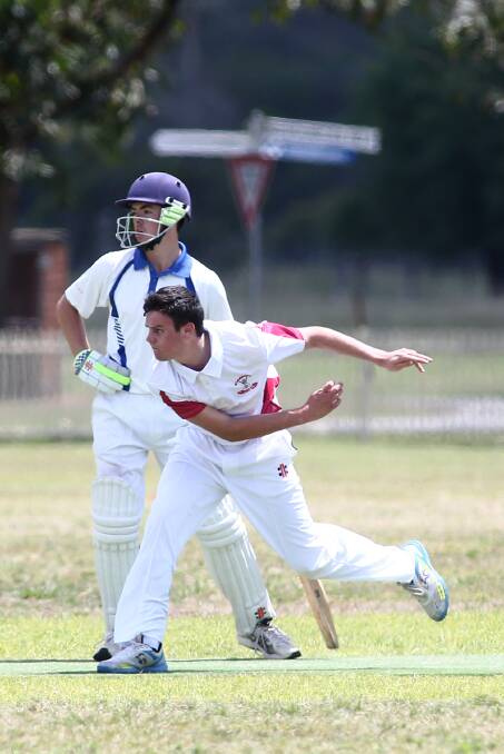Matt Chilmade bowls for Glossodia in fourth grade cricket. Picture: Geoff Jones