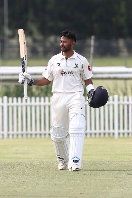 Jaskaran Cheema raises the bat after making his maiden first grade century for Hawkesbury at the weekend. Picture: Geoff Jones