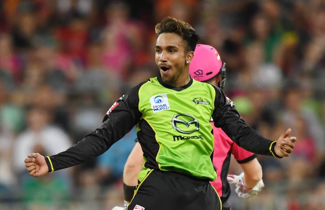 Arjun Nair of the Thunder celebrates as Johan Botha of the Sixers is dismissed for LBW from one of his deliveries during the Big Bash League (BBL) cricket match between the Sydney Thunder and Sydney Sixers at the Spotless Stadium in Sydney, Tuesday, December 19, 2017. (AAP Image/David Moir) NO ARCHIVING, EDITORIAL USE ONLY